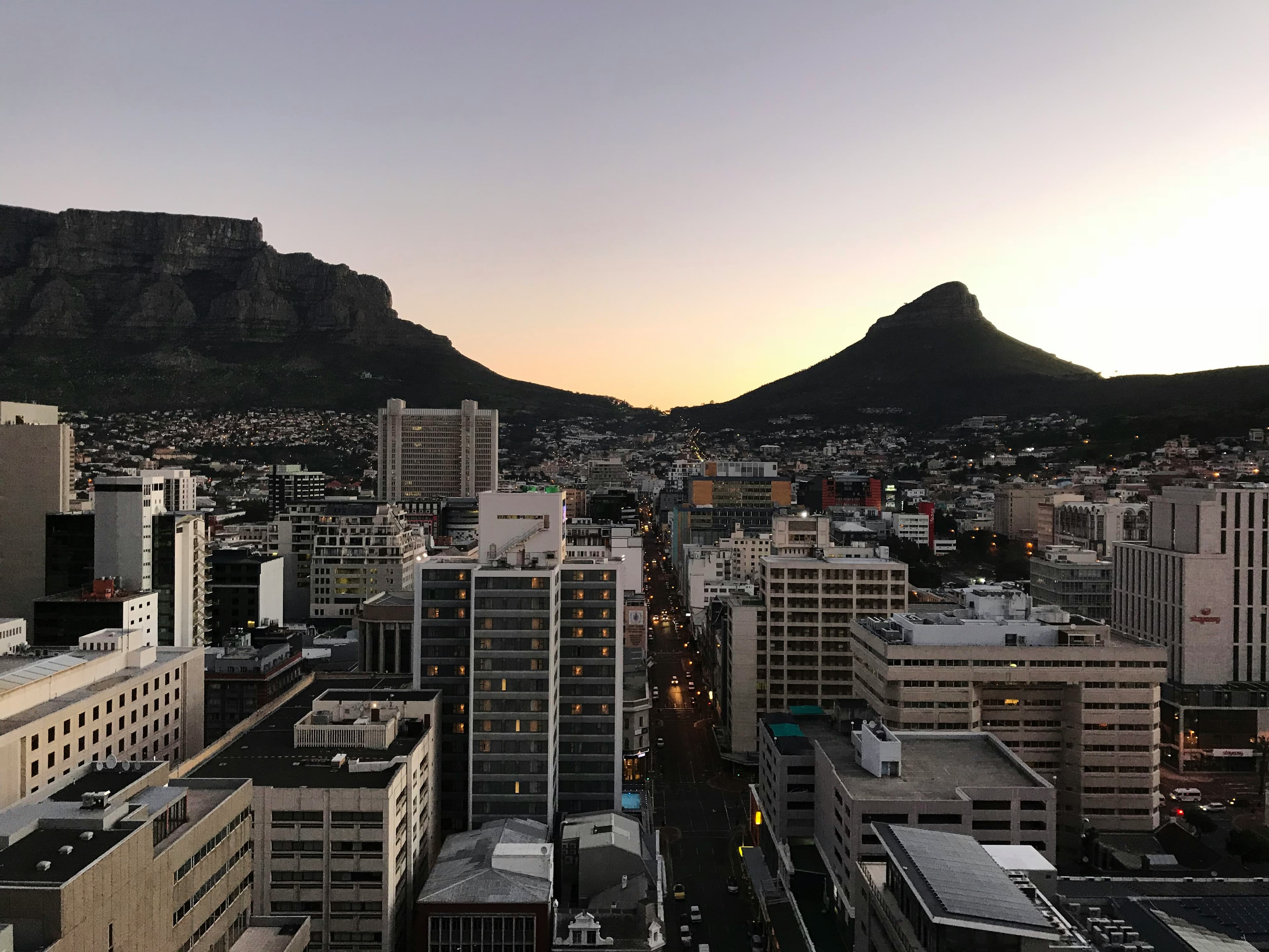 Cape Town at dusk, beneath Table Mountain and Lion's Head